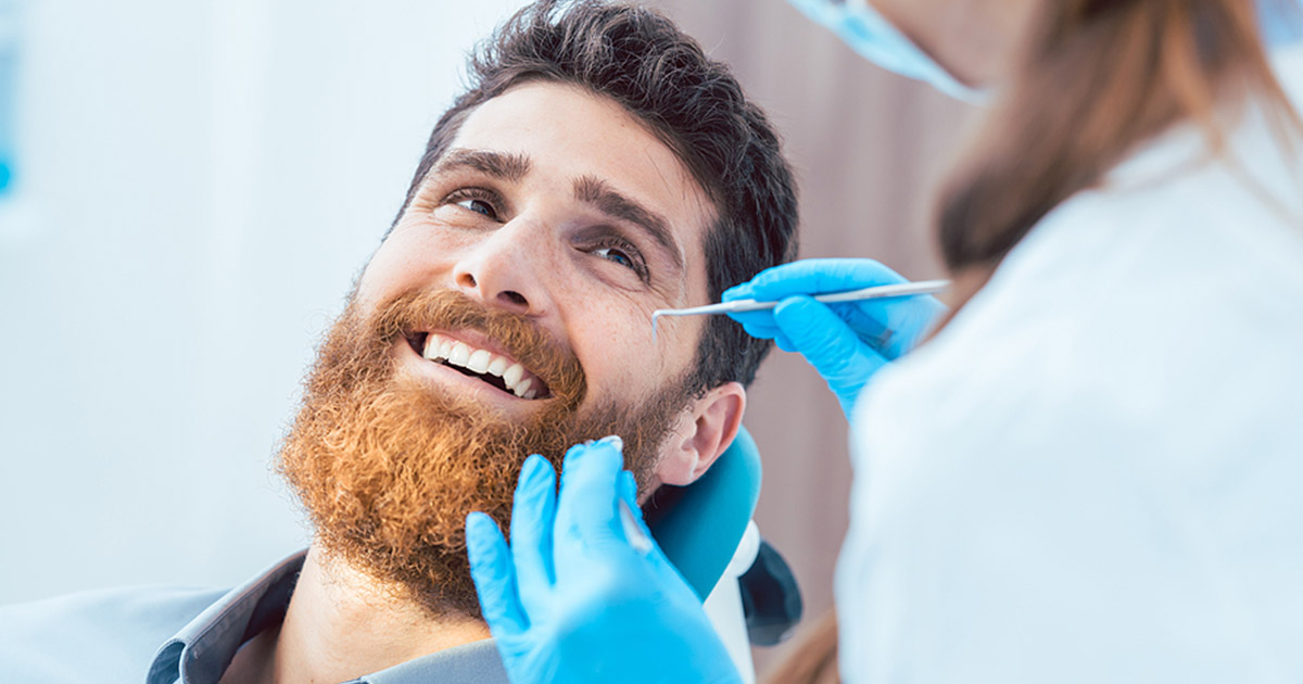 San Francisco man getting a dental cleaning during dental exam