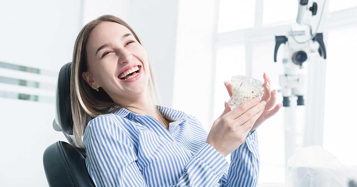 Woman smiling during treatment at San Francisco holistic and general dentistry