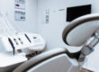 A modern dental office with a dental chair and equipment.
